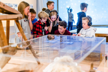Young students visiting an exhibition